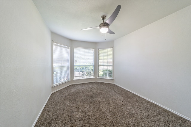 unfurnished room featuring carpet floors and ceiling fan