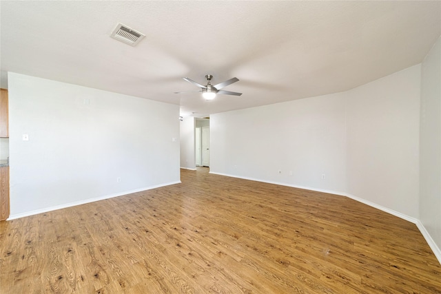 spare room with ceiling fan and light hardwood / wood-style floors