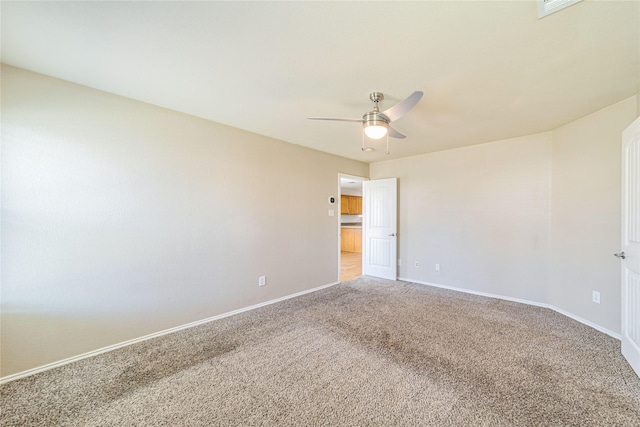 carpeted empty room with ceiling fan