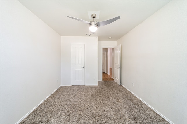 unfurnished bedroom with ceiling fan and carpet