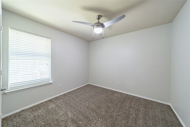 empty room with carpet floors and ceiling fan