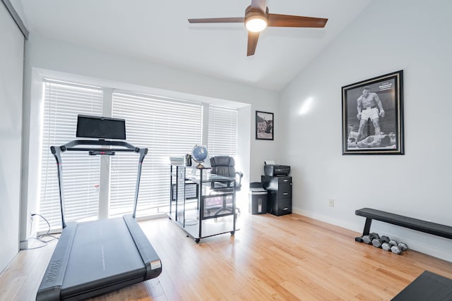 workout room featuring hardwood / wood-style flooring, ceiling fan, and lofted ceiling