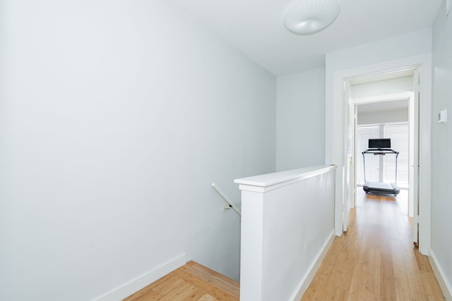 corridor featuring light hardwood / wood-style floors