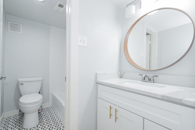 bathroom featuring a bathing tub, tile patterned flooring, vanity, and toilet