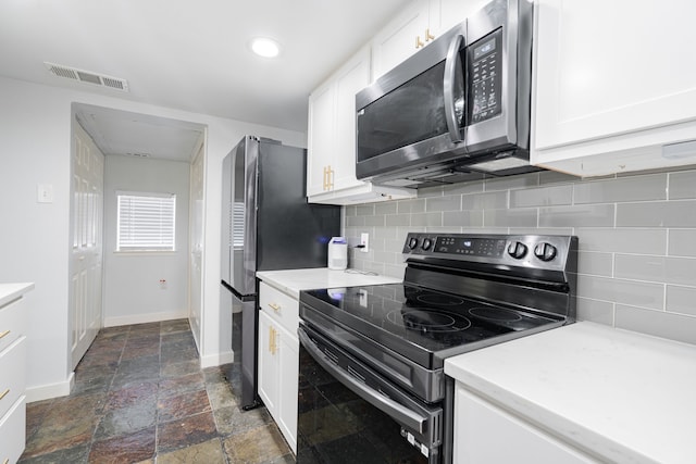 kitchen featuring white cabinetry, backsplash, and appliances with stainless steel finishes