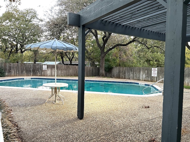 view of pool with a patio area and a pergola