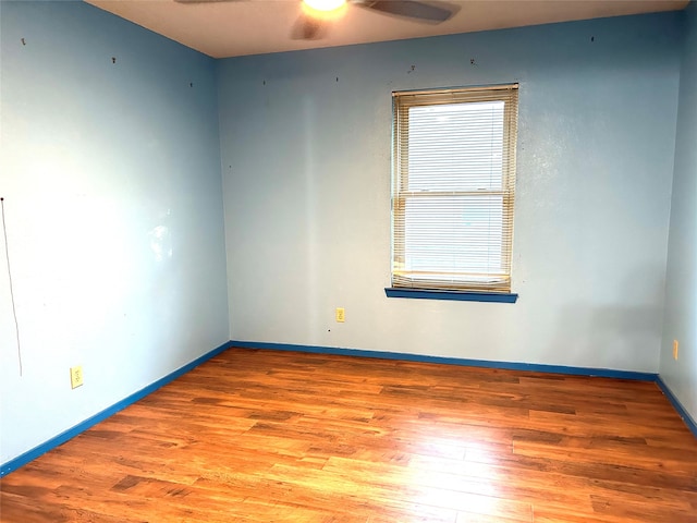 unfurnished room featuring ceiling fan and light wood-type flooring