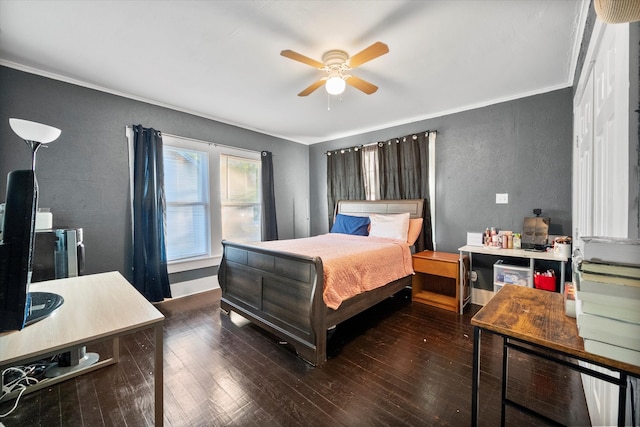 bedroom with ceiling fan, crown molding, and dark wood-type flooring