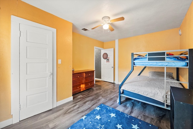 bedroom with wood-type flooring and ceiling fan