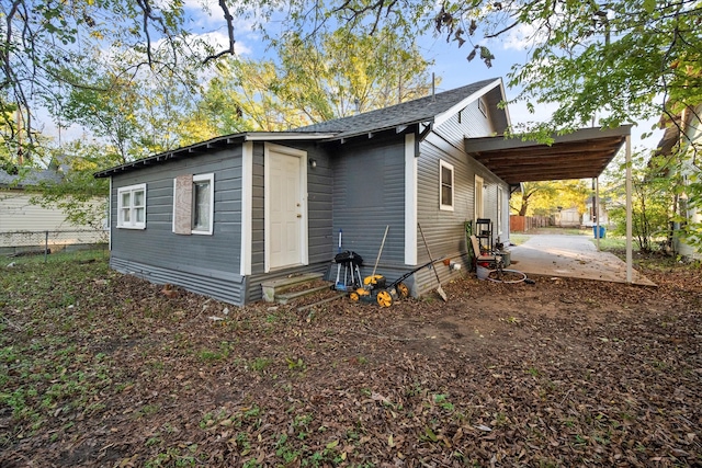 view of side of home featuring a carport