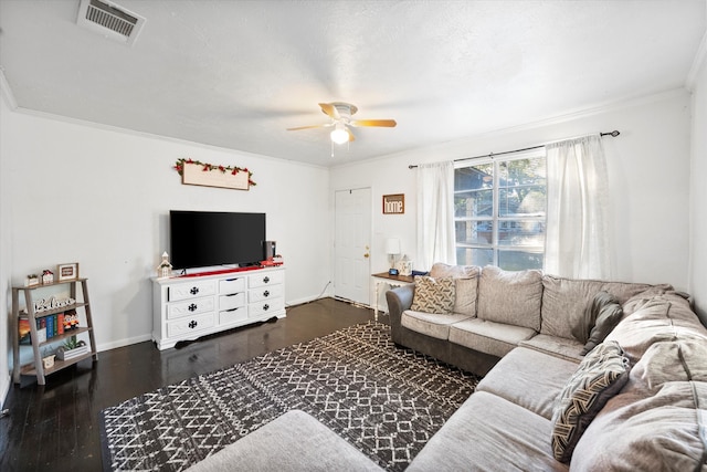 living room featuring dark hardwood / wood-style flooring, ceiling fan, and crown molding