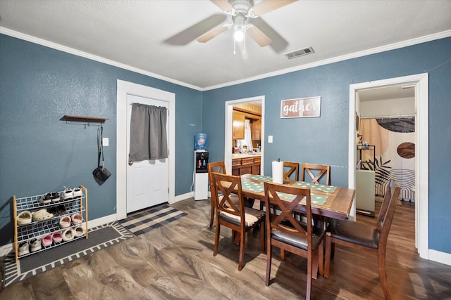 dining area with crown molding, hardwood / wood-style floors, and ceiling fan