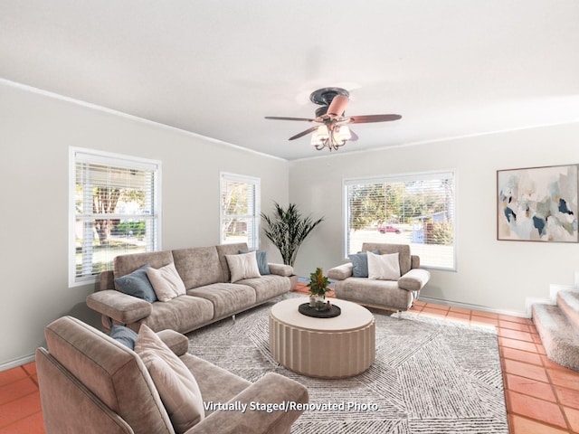 living room with ceiling fan, ornamental molding, and tile patterned flooring