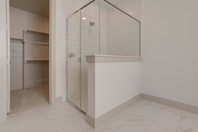 bathroom with a shower with shower door