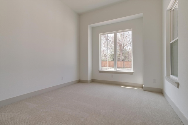 empty room featuring light colored carpet