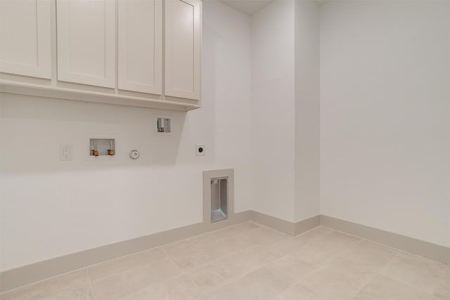 clothes washing area with light tile patterned flooring, gas dryer hookup, cabinets, hookup for a washing machine, and electric dryer hookup