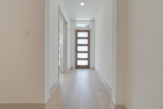 doorway to outside featuring light hardwood / wood-style flooring