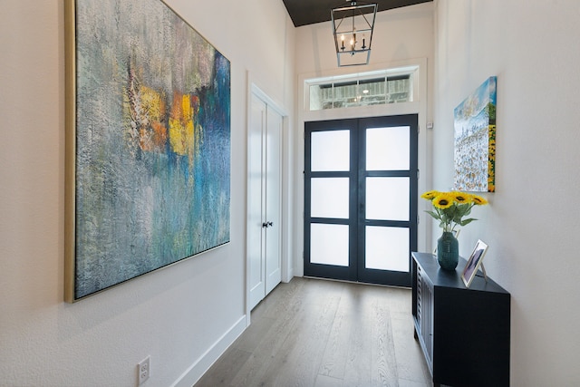 2608 Camden Ct, Celina, TX 75009 - entryway featuring french doors, wood finished floors, and baseboards