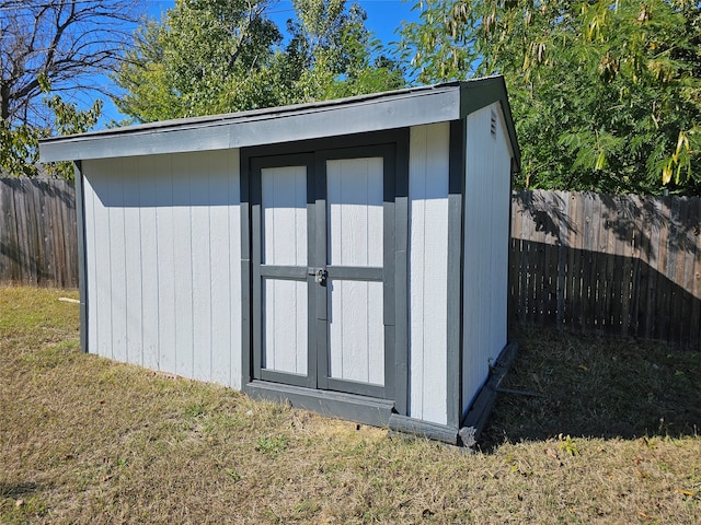 view of outdoor structure with a lawn