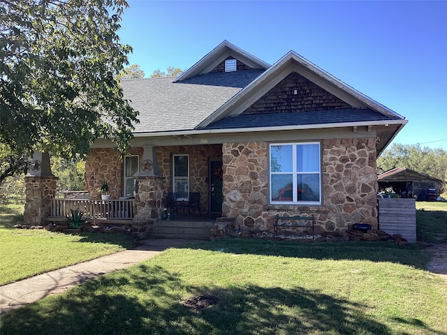 view of front of property with a porch and a front lawn