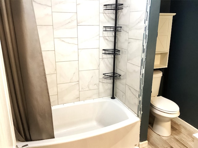 bathroom featuring hardwood / wood-style floors and toilet