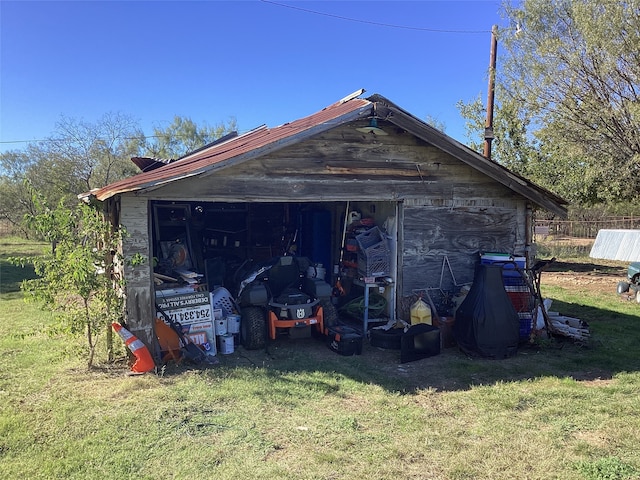 view of outbuilding with a yard