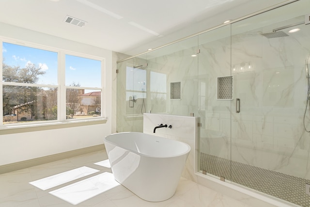 full bath with visible vents, baseboards, marble finish floor, a soaking tub, and a marble finish shower