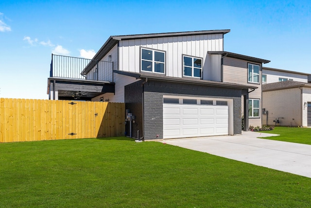 view of front of house featuring concrete driveway, a front yard, board and batten siding, and brick siding