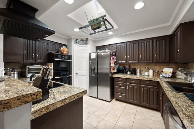 kitchen featuring light stone counters, sink, ornamental molding, and appliances with stainless steel finishes