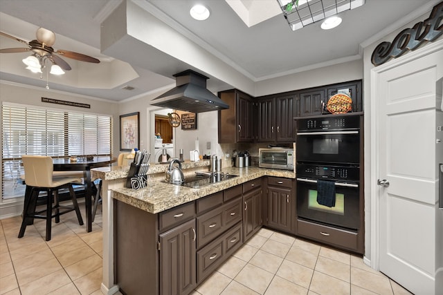 clothes washing area featuring light tile patterned floors, separate washer and dryer, and ceiling fan