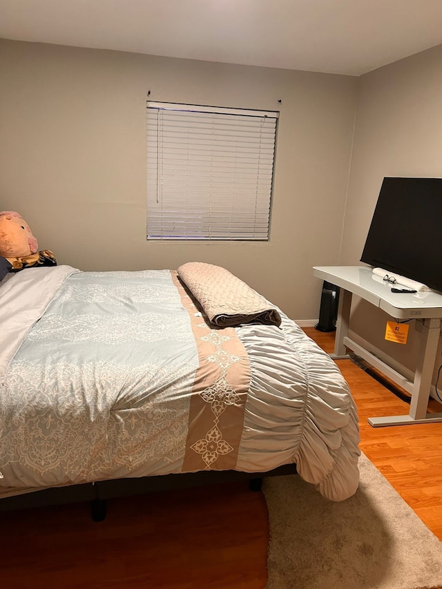 bedroom featuring hardwood / wood-style flooring