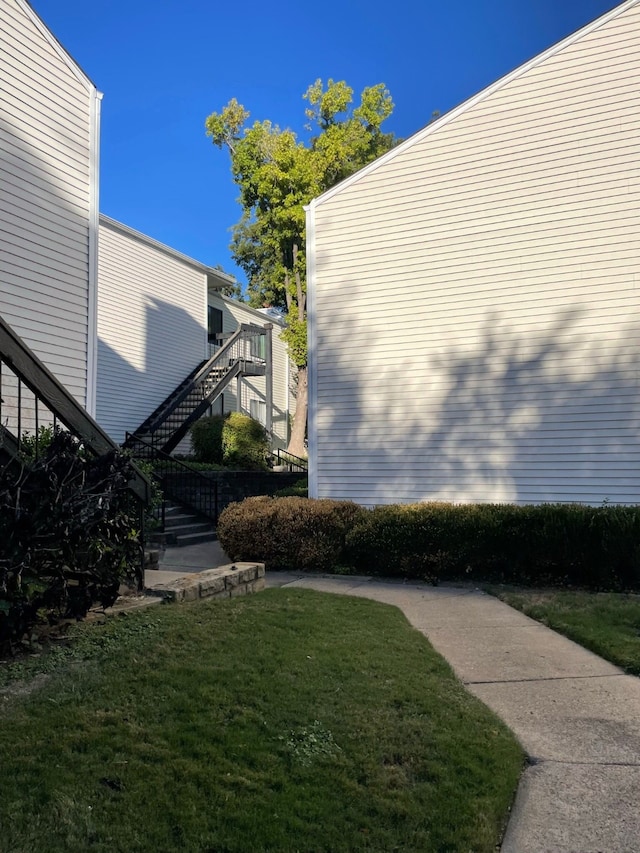 view of side of home featuring a yard