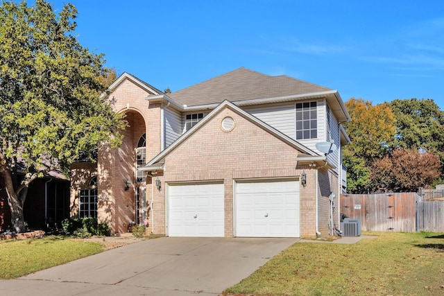 traditional home featuring brick siding, concrete driveway, a front yard, and fence