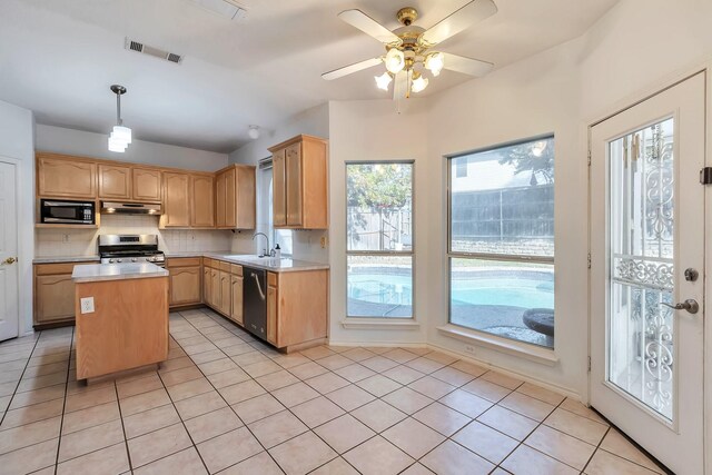 empty room featuring carpet flooring, ceiling fan, and vaulted ceiling