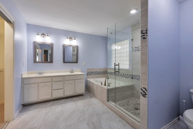 full bathroom featuring vanity, separate shower and tub, and toilet