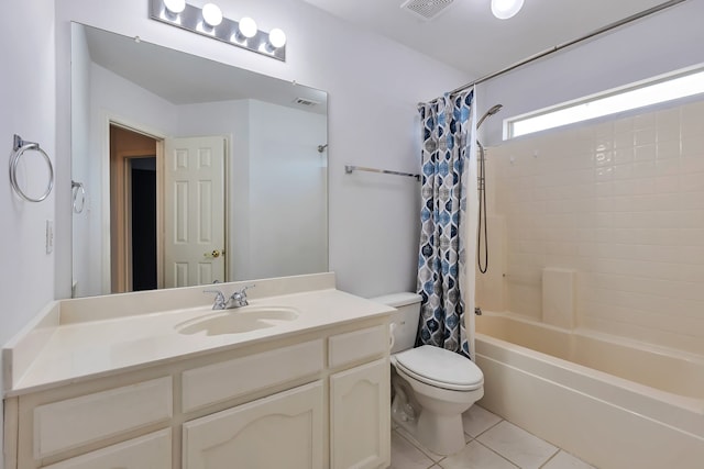 full bathroom featuring tile patterned floors, vanity, shower / bath combination with curtain, and toilet