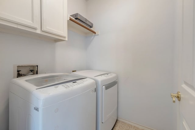 laundry area with cabinets and independent washer and dryer