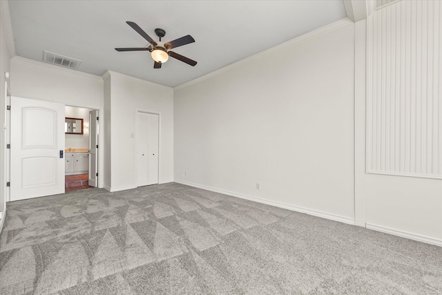 unfurnished bedroom with carpet floors, crown molding, and ceiling fan