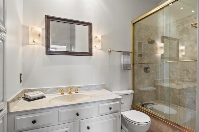 full bathroom with shower / bath combination with glass door, vanity, and toilet