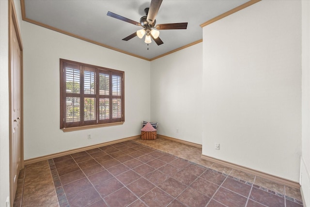 spare room with ceiling fan and crown molding