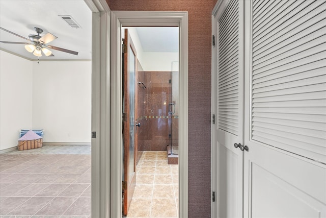 hall featuring light tile patterned floors