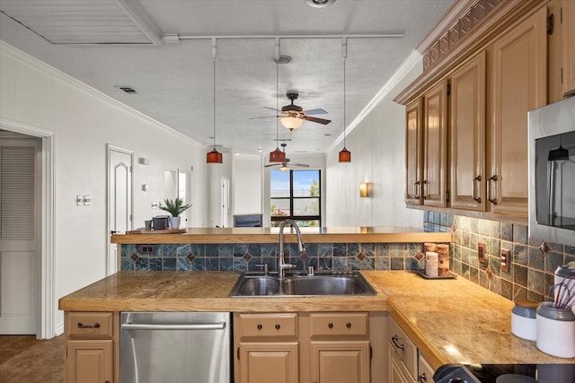 kitchen with ceiling fan, sink, tasteful backsplash, tile patterned floors, and ornamental molding