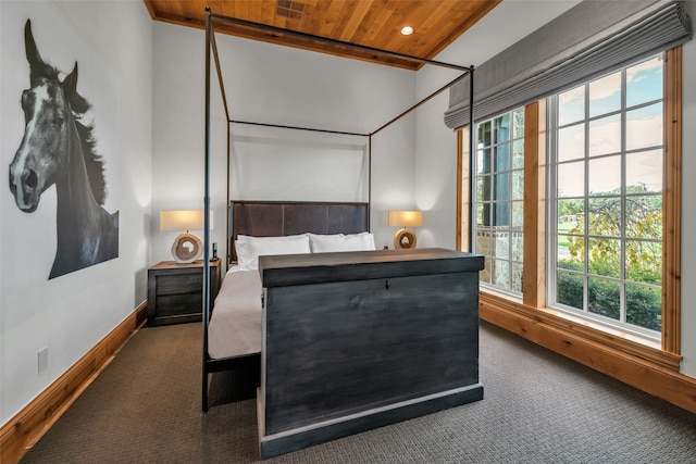 carpeted bedroom with multiple windows and wood ceiling