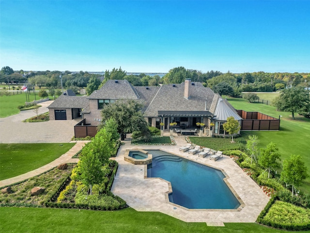 view of swimming pool with a pergola, an in ground hot tub, a lawn, and a patio