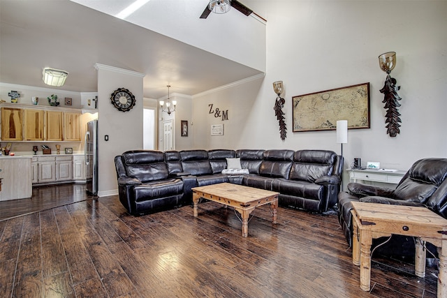 living room featuring ceiling fan with notable chandelier, crown molding, and dark wood-type flooring