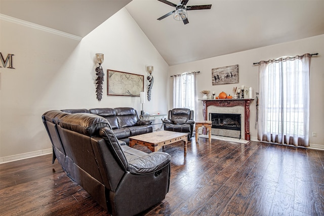 living room featuring ceiling fan, high vaulted ceiling, a premium fireplace, and dark hardwood / wood-style floors