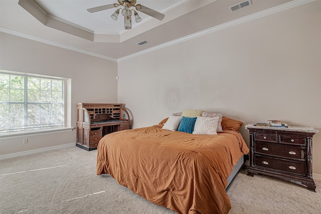 bedroom with light carpet, a raised ceiling, ceiling fan, and crown molding