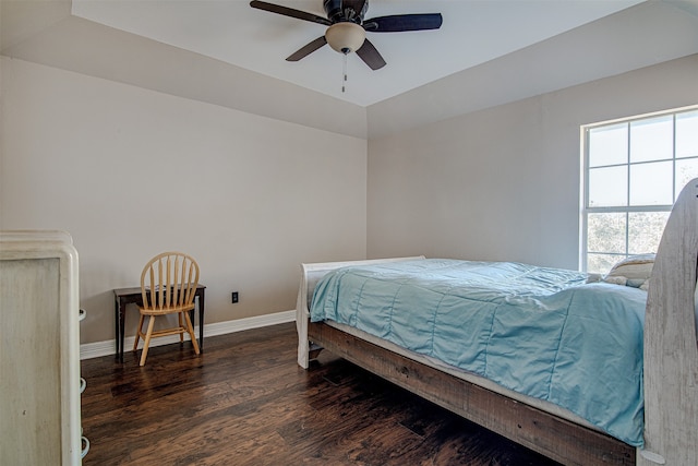 bedroom with dark hardwood / wood-style floors and ceiling fan