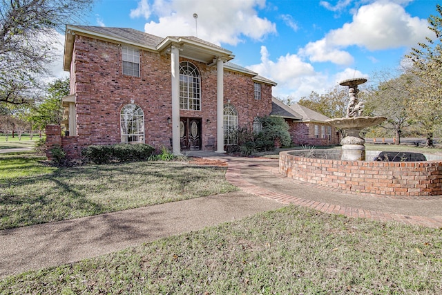 view of front facade with a front yard