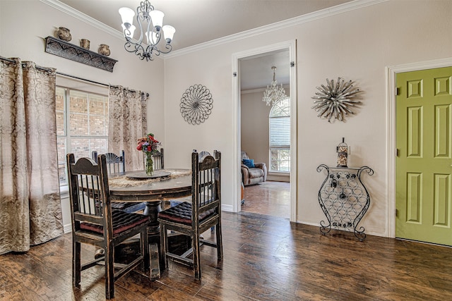 dining space featuring an inviting chandelier, dark wood-type flooring, and ornamental molding